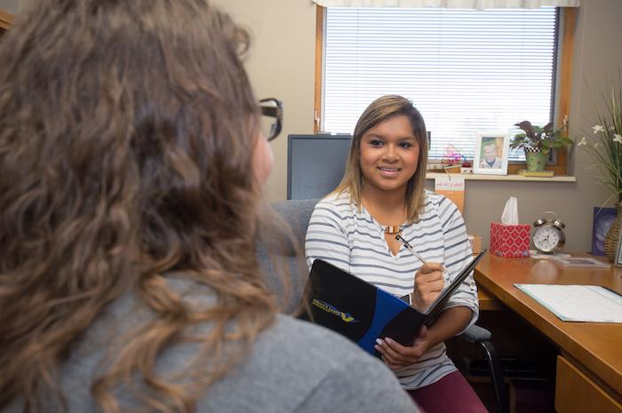 A communications major interviewing another student